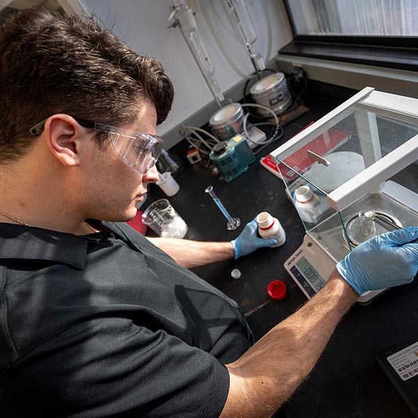 A photo of a person working in an engineering lab